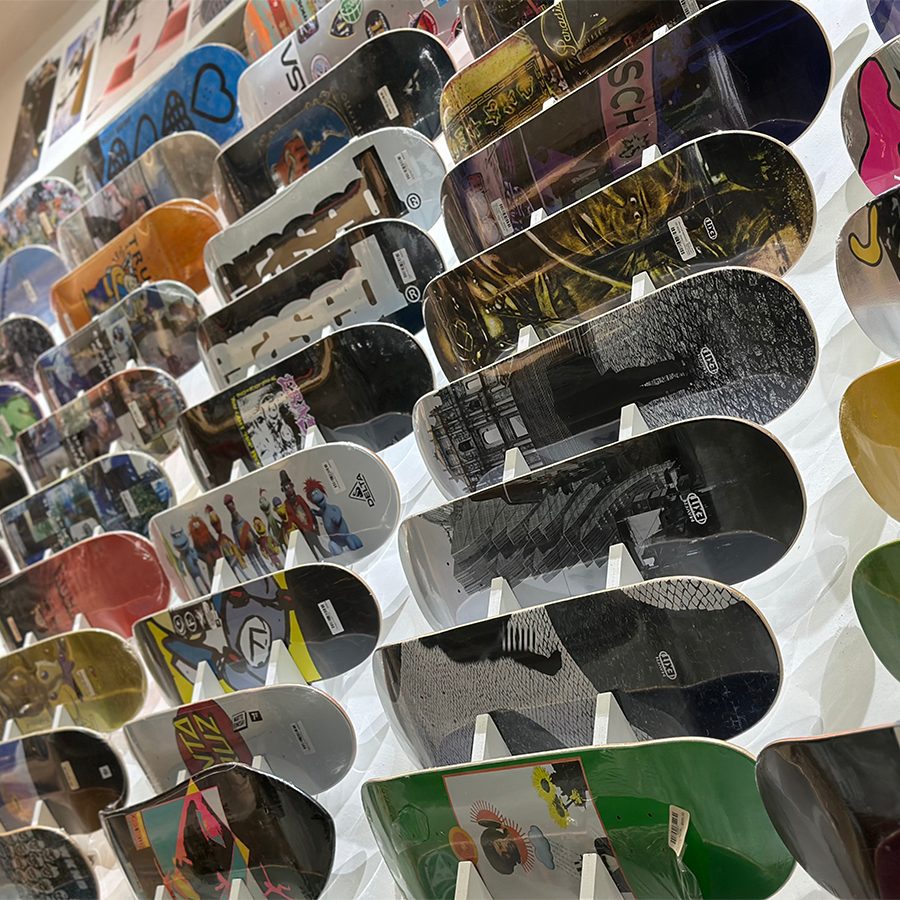 A variety of skateboards on display on a wall at Ride 2 Exit.  