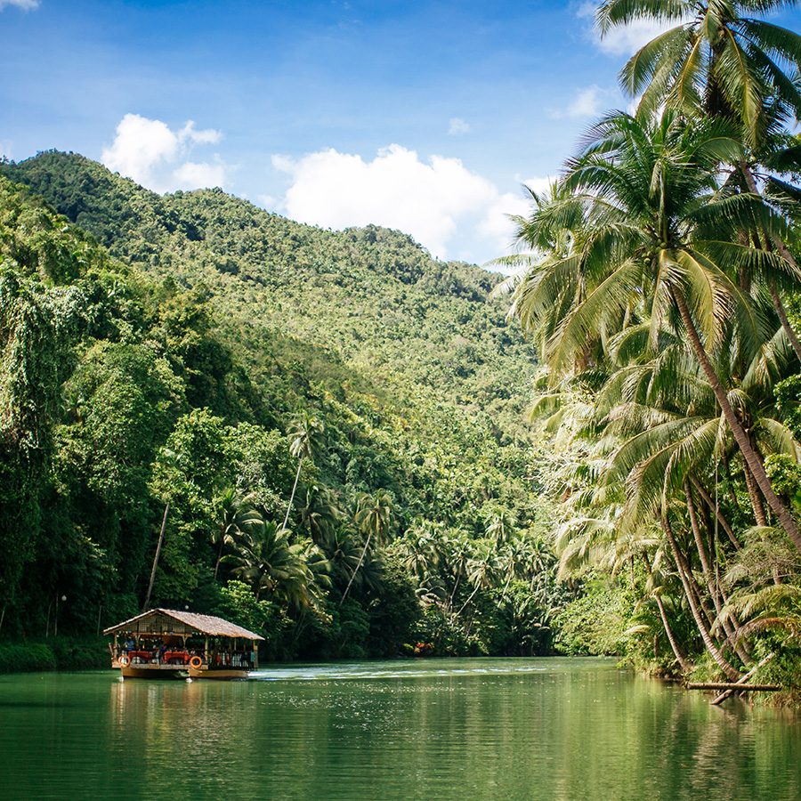 View of a boat cruising down the Loboc River in the Philippines