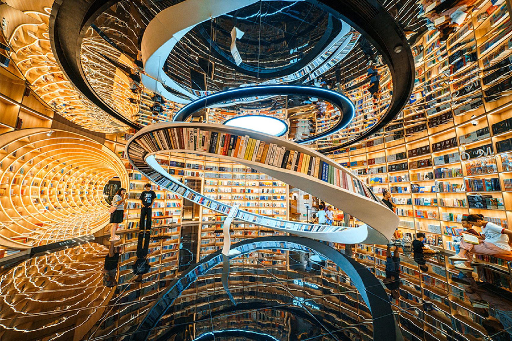 Interior of Yuishin Books in Shenzhen, famous for its swirling décor and warm lighting.