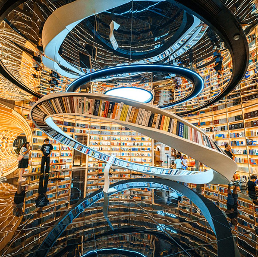 Interior of Yuishin Books in Shenzhen, famous for its swirling décor and warm lighting.