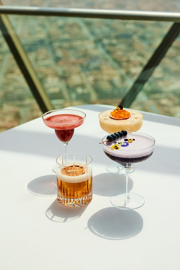 Four cocktails arranged on a table at The Globe in Riyadh.