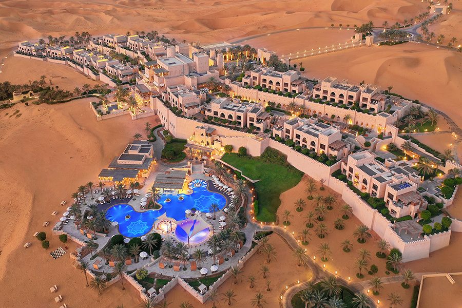 Bird’s eye view of Qasr Al Sarab Desert Resort by Anantara surrounded by an expansive desert in Abu Dhabi 
