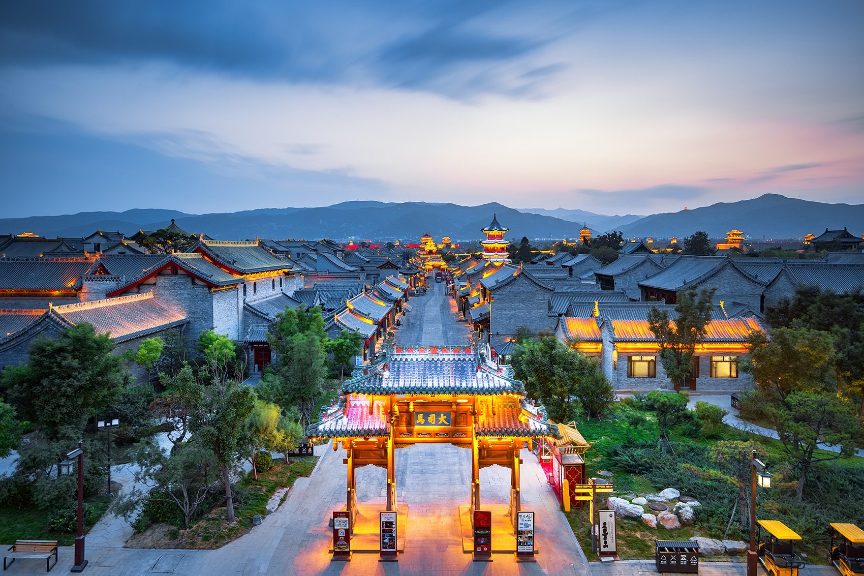 Ancient part of a Chinese city lit up during the evening.