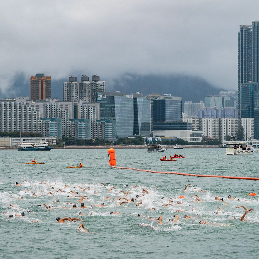 Big crowd of swimmers racing across Victoria Harbour at the Hong Kong Harbour Race 