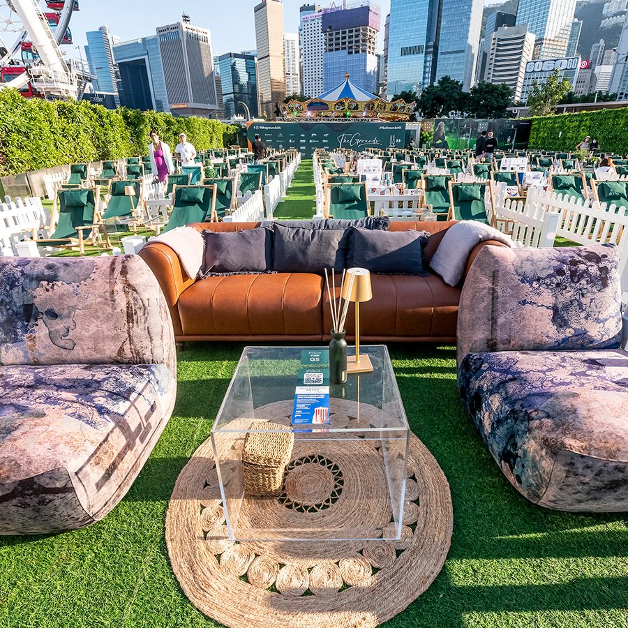Shot of a booth at The Grounds with couches and a coffee table set up