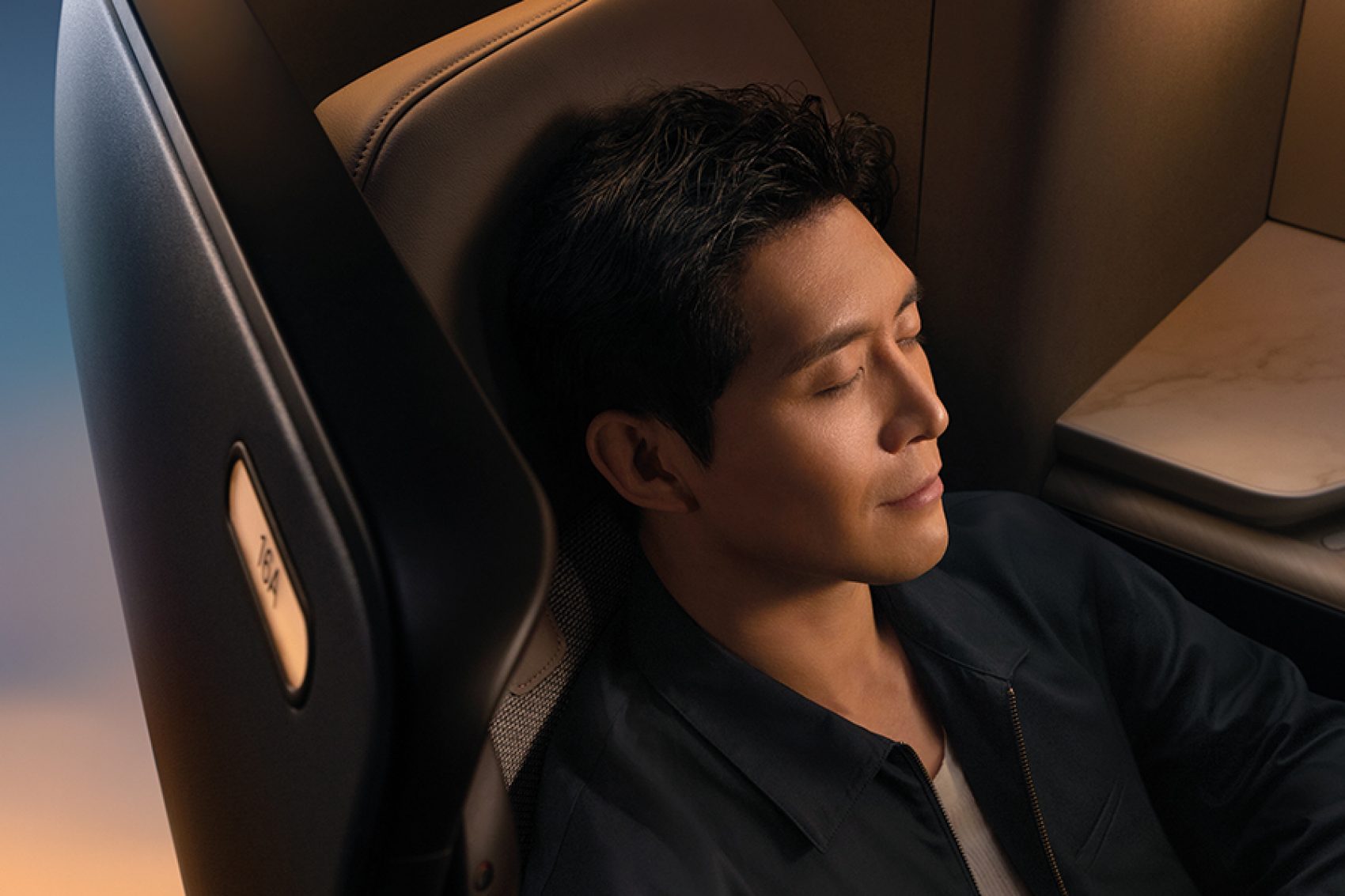 Close-up of a man sleeping in Cathay Pacific’s new Aria Suite. 