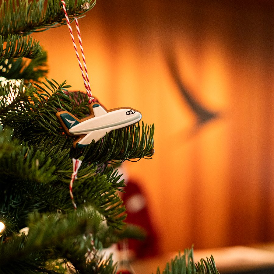 Close-up of an airplane ornament on a Christmas tree in the Cathay lounge.