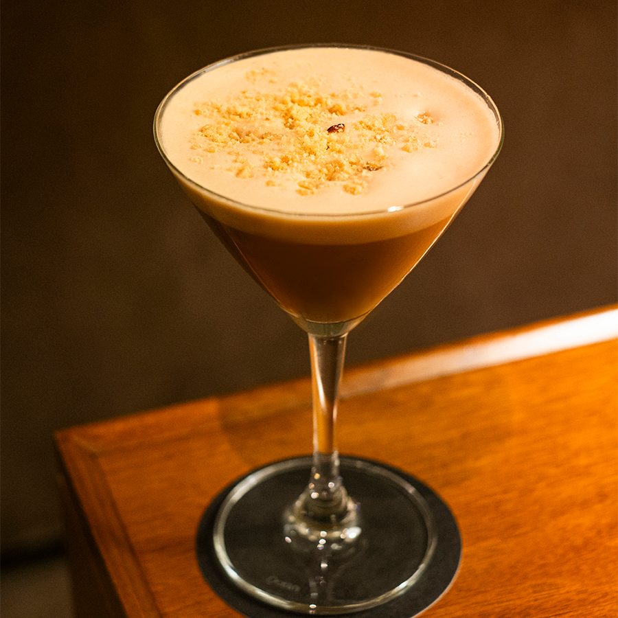 A gingerbread espresso martini placed on the table.