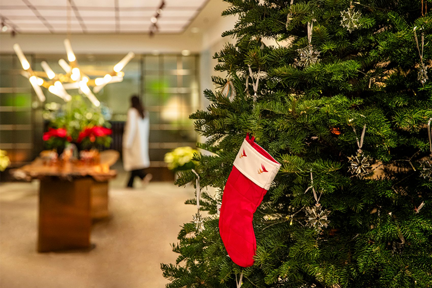 Close-up of a stocking hanging from a Christmas tree in the Cathay lounge. 