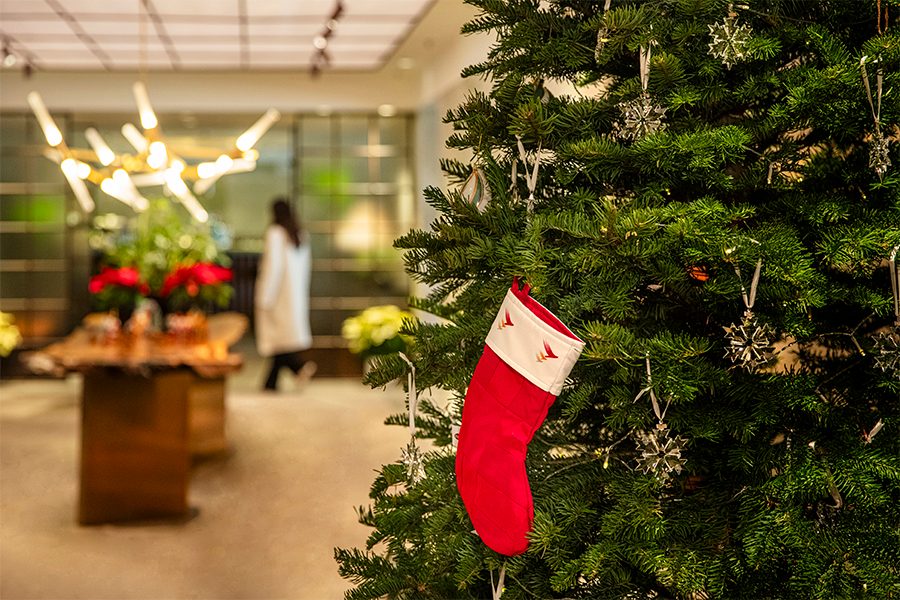 Close-up of a stocking hanging from a Christmas tree in the Cathay lounge. 