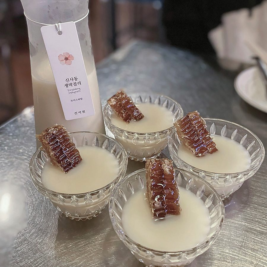 Seoul restaurant Sinsajeon’s viral drink, where makgeolli is poured over honeycomb.