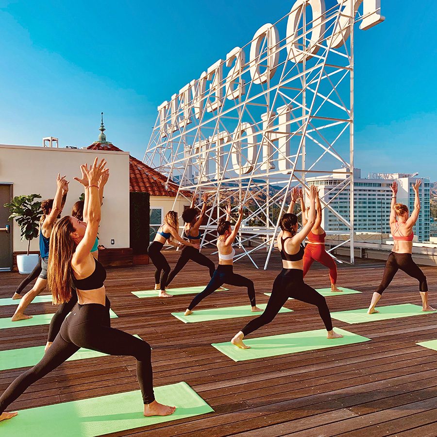 Guests doing yoga on Hotel Roosevelt rooftop