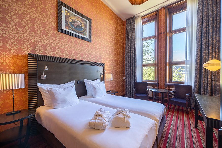 Double beds in one of Grand Hotel Amrâth Amsterdam's bedrooms.