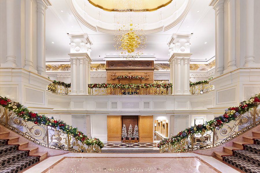 Lotte New York Palace's lobby with a set of split staircases.