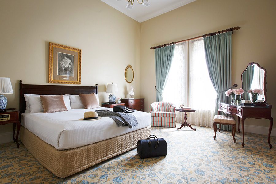 A bright hotel room at The Hotel Windsor.