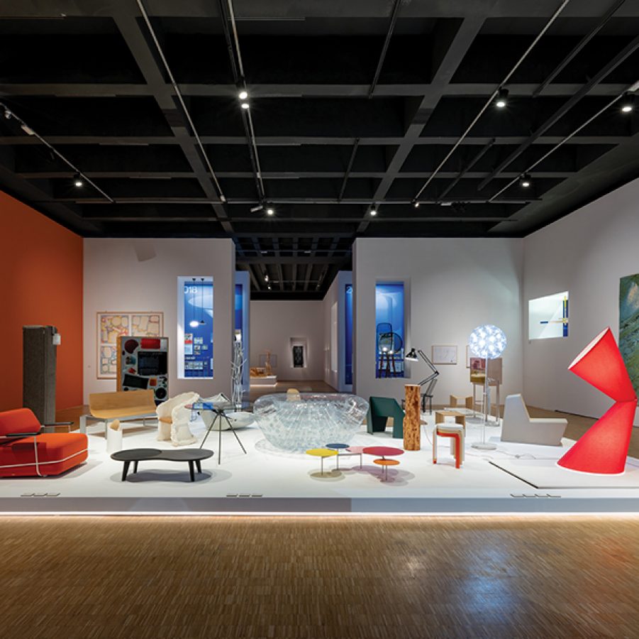 An art exhibition with a variety of colourful furniture.