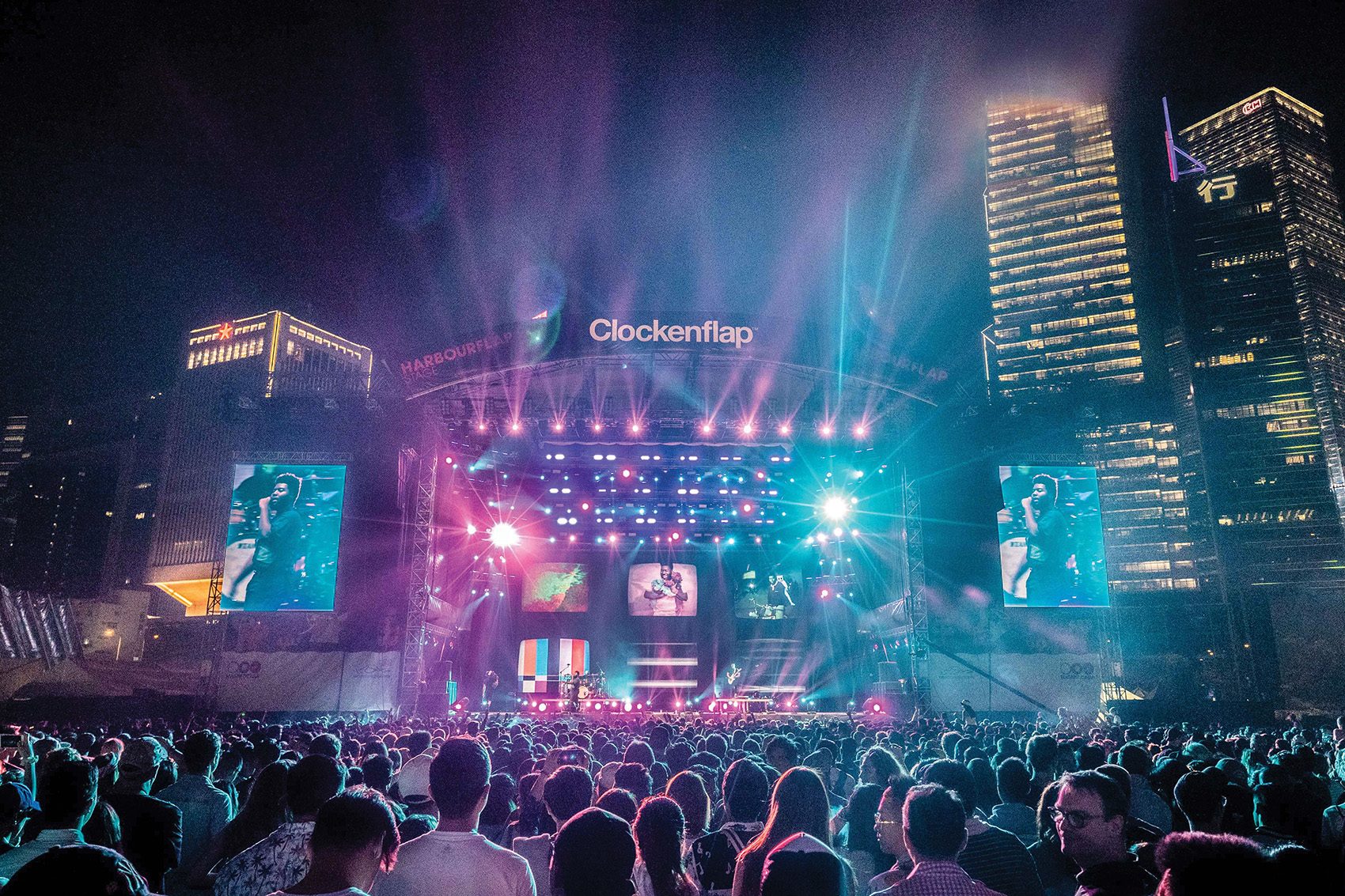 A crowd of people in front of a stage at Clockenflap.