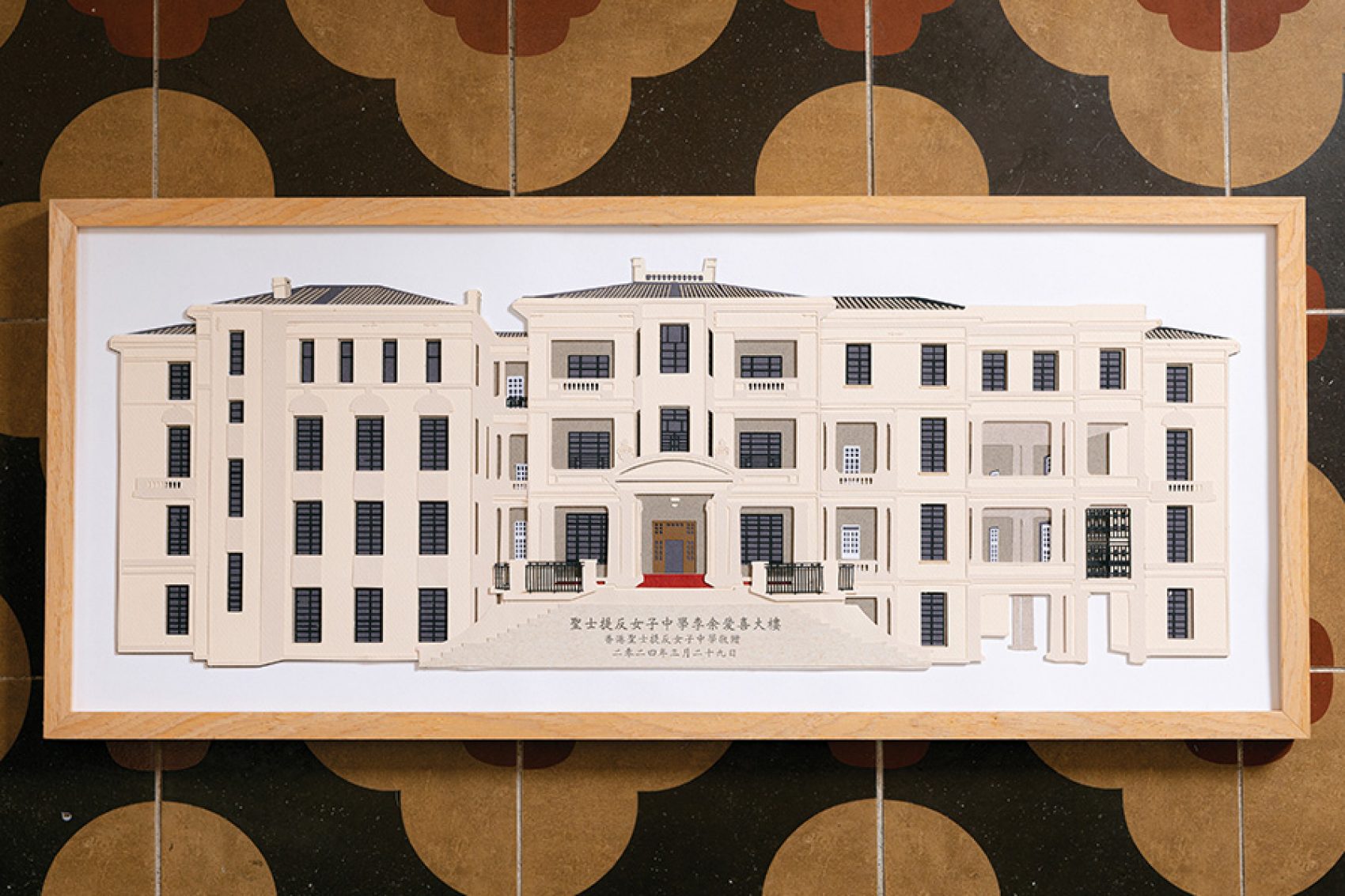 A paper cutout with eight different layers representing St. Stephen’s Girls’ College, designed by Nick Tsao.