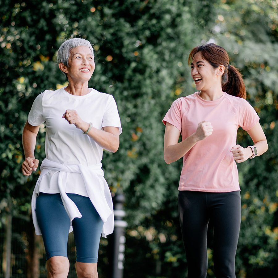  Two women running outdoors.