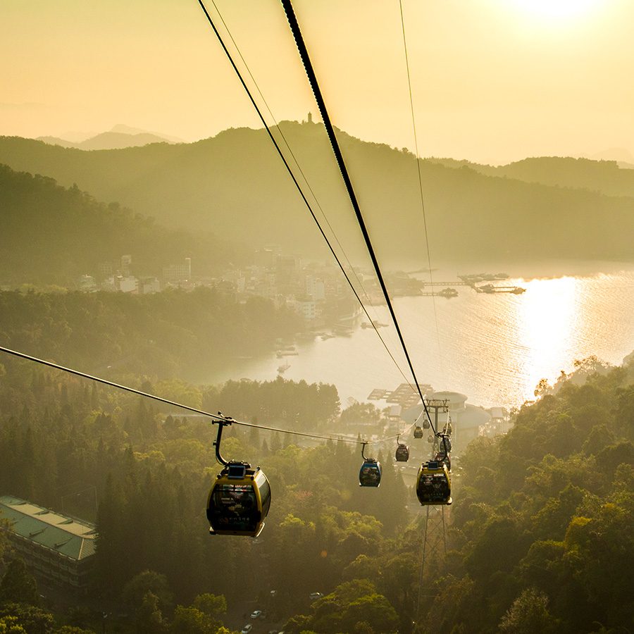 Cable cars suspended above the mountains surrounding Sun Moon Lake, Taichung. 