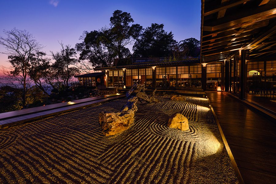 Exterior of Michelin-listed restaurant Inflorescence, dimly lit at night.