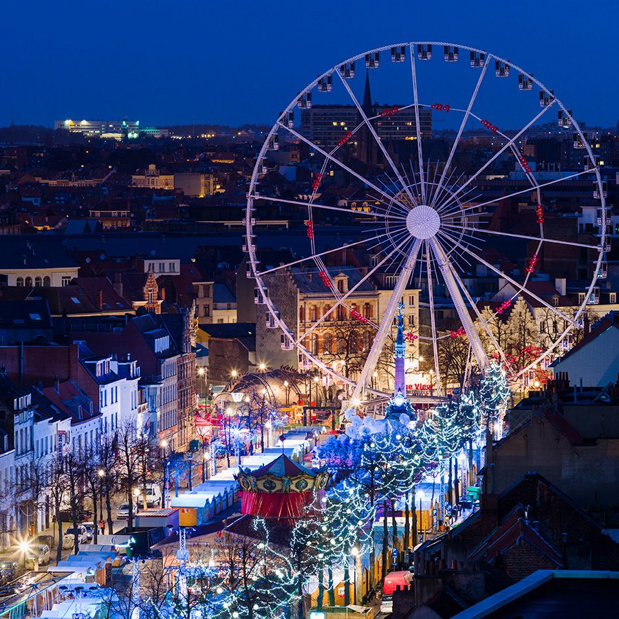 Aerial view of the Christmas market and ferris wheel at Place Sainte-Catherine in Brussels. 