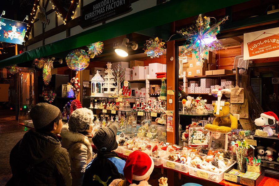 A stall at a Christmas market selling crafts. 