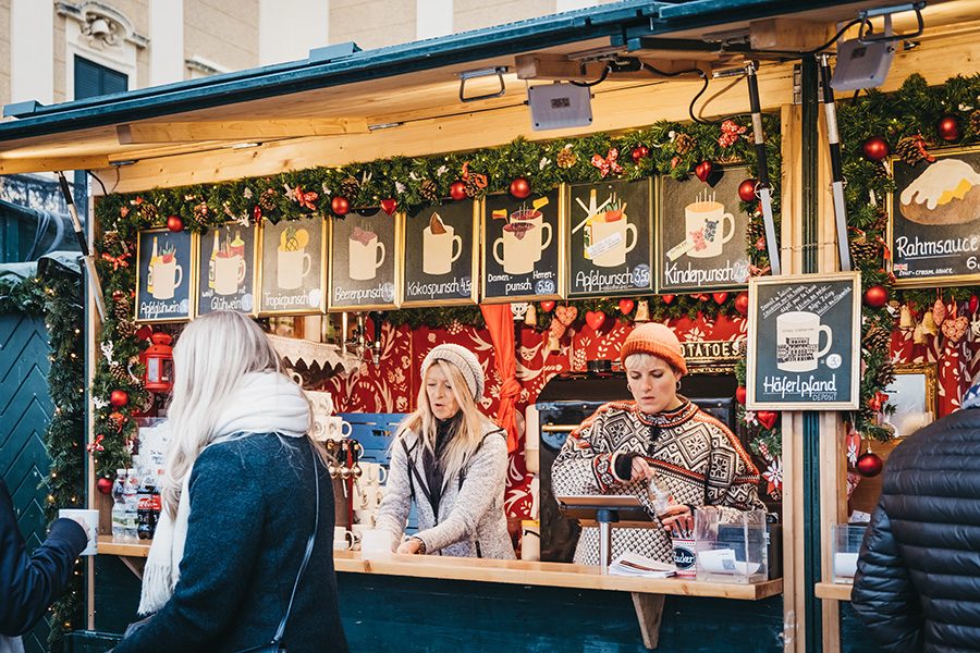 A stall at a Vienna Christmas market selling hot drinks.