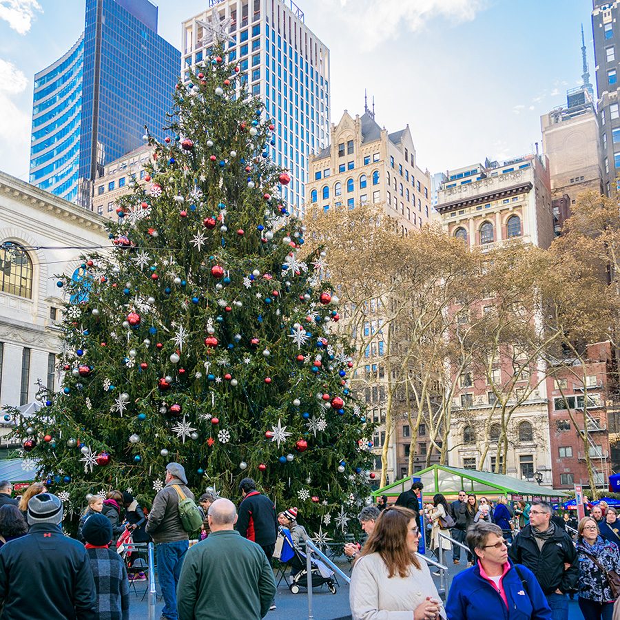 A Christmas tree in the middle of crowded Herald Square in New York. 