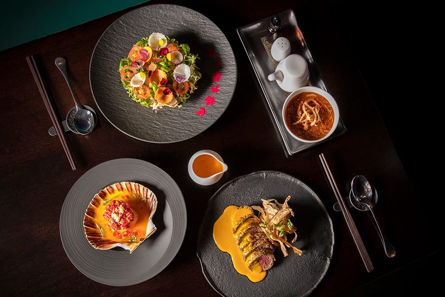 Spread of dishes on a Hakkasan table.