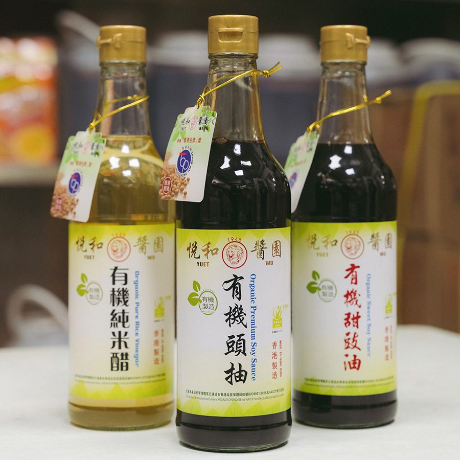 Three bottles of seasoning – soy sauce and rice wine – often used in Chinese cooking, are placed next to each other on a table. 