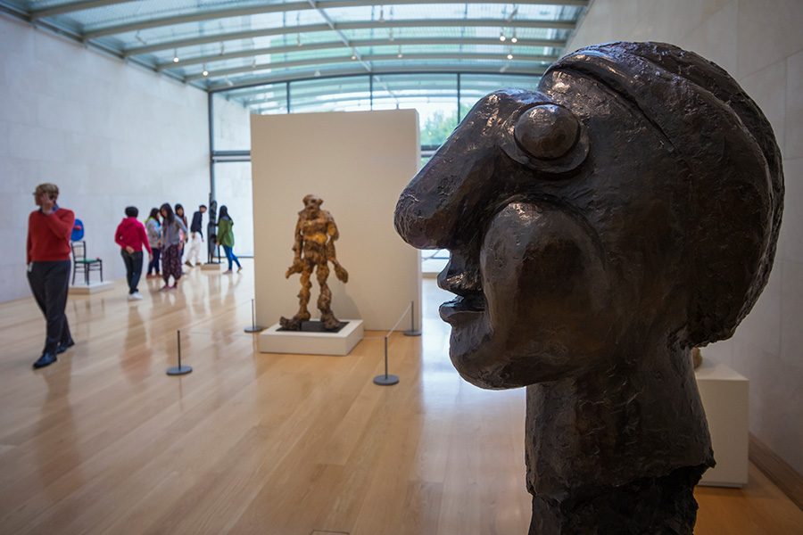 Modern sculptures inside a gallery with a glass ceiling at the Nasher Sculpture Center 