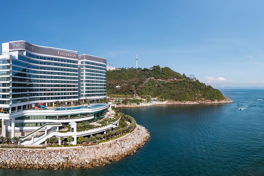 A wide landscape view of Fullerton Ocean Park Hotel by the sea during daytime in Hong Kong.