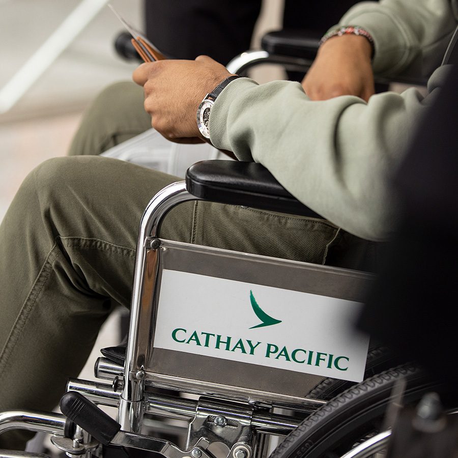  A person sitting on a rented Cathay Pacific wheelchair