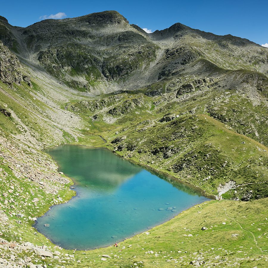 A landscape view of Lagh de Calvaresc hills and river in Zurich during daytime 