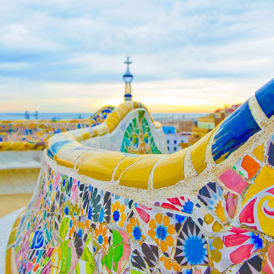 A view of the colourful Park Güell walls in Barcelona during daytime 