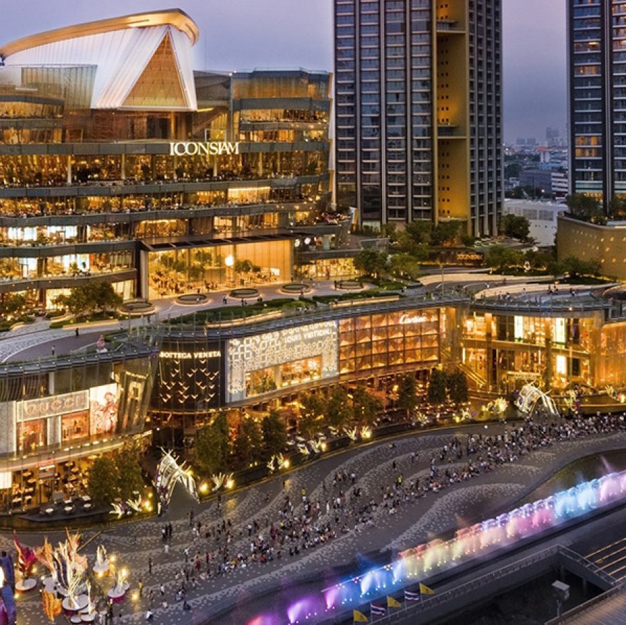 Lit-up façade of Bangkok’s ICONSIAM at night. 