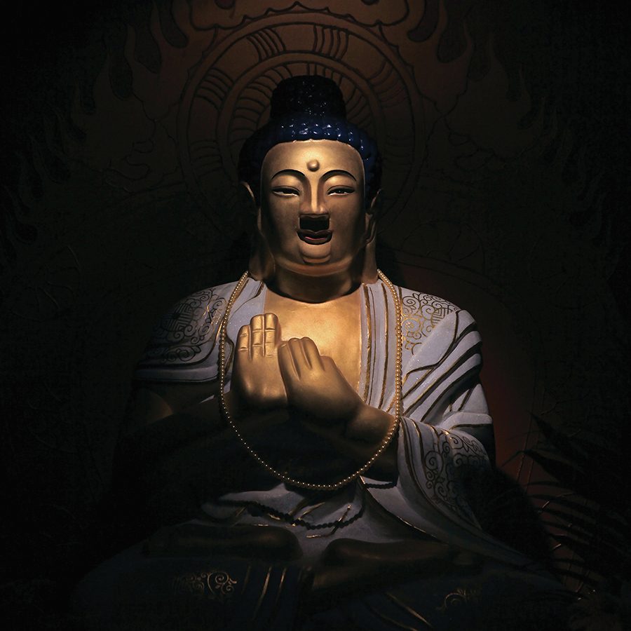 A seated Buddha sculpture in the interior shrine at Jinding, Mount Emei, Sichuan. 