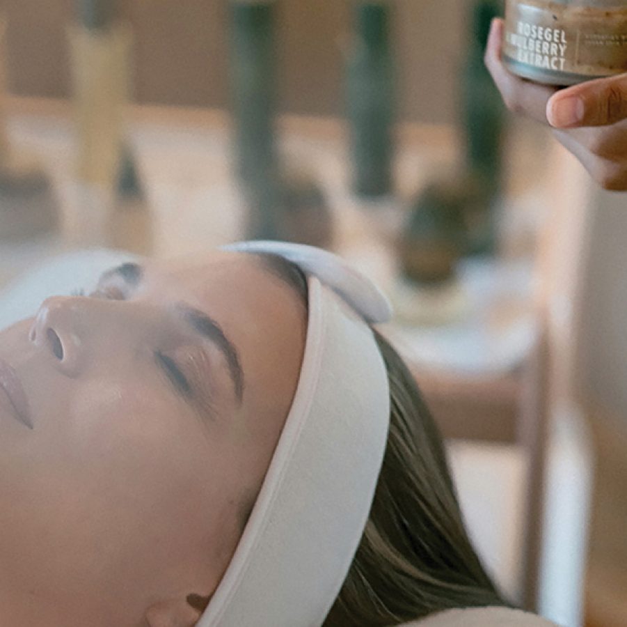A woman enjoying a facial using cosmetics from Fields of Yarrow, at Revivo Wellness Resort in Bali.