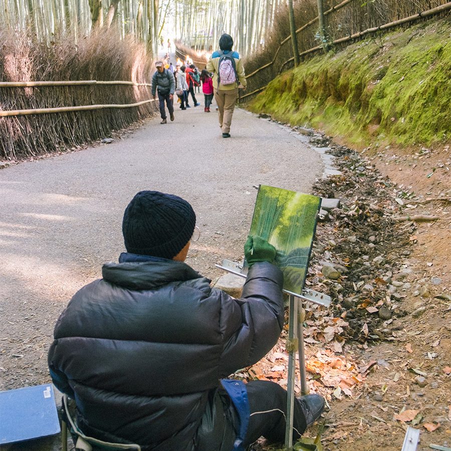 Old man painting Arashiyama bamboo forest