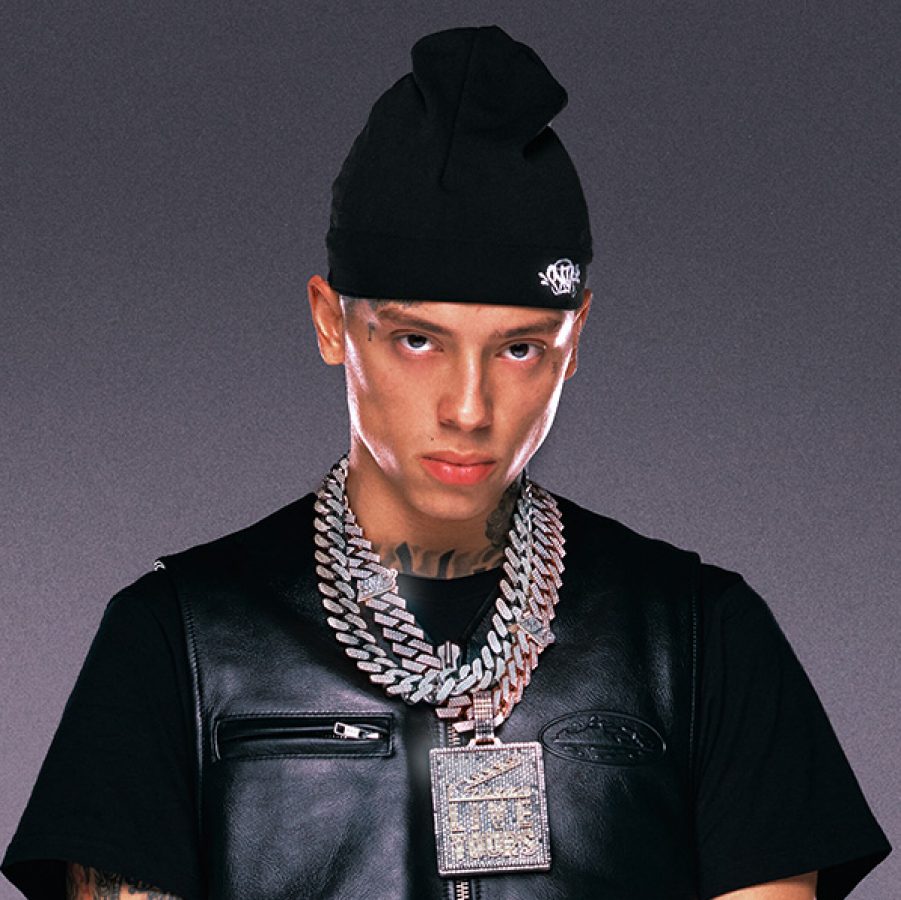 Rapper Central Cee stood alone against a purple and black backdrop.