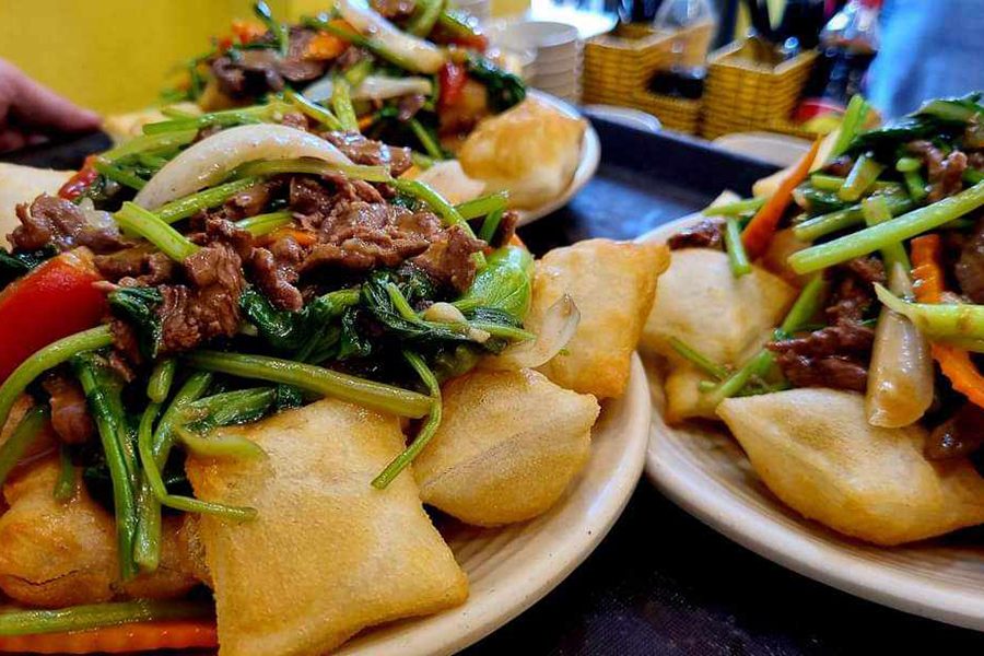 Plates of spring rolls and beef at Pho Cuon 31, Hanoi.