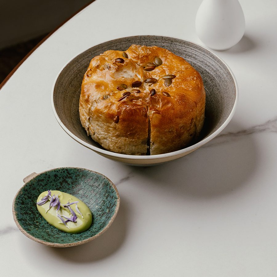Feuille’s signature bread with Chinese chive pil pil.