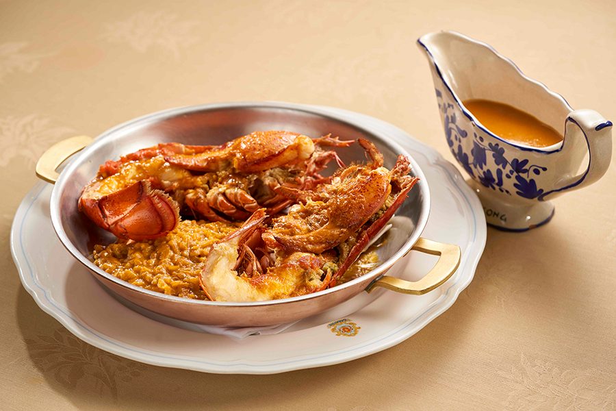 Close up shot of Sabatini Ristorante Italiano’s signature oven baked lobster in Sabatini style with risotto.