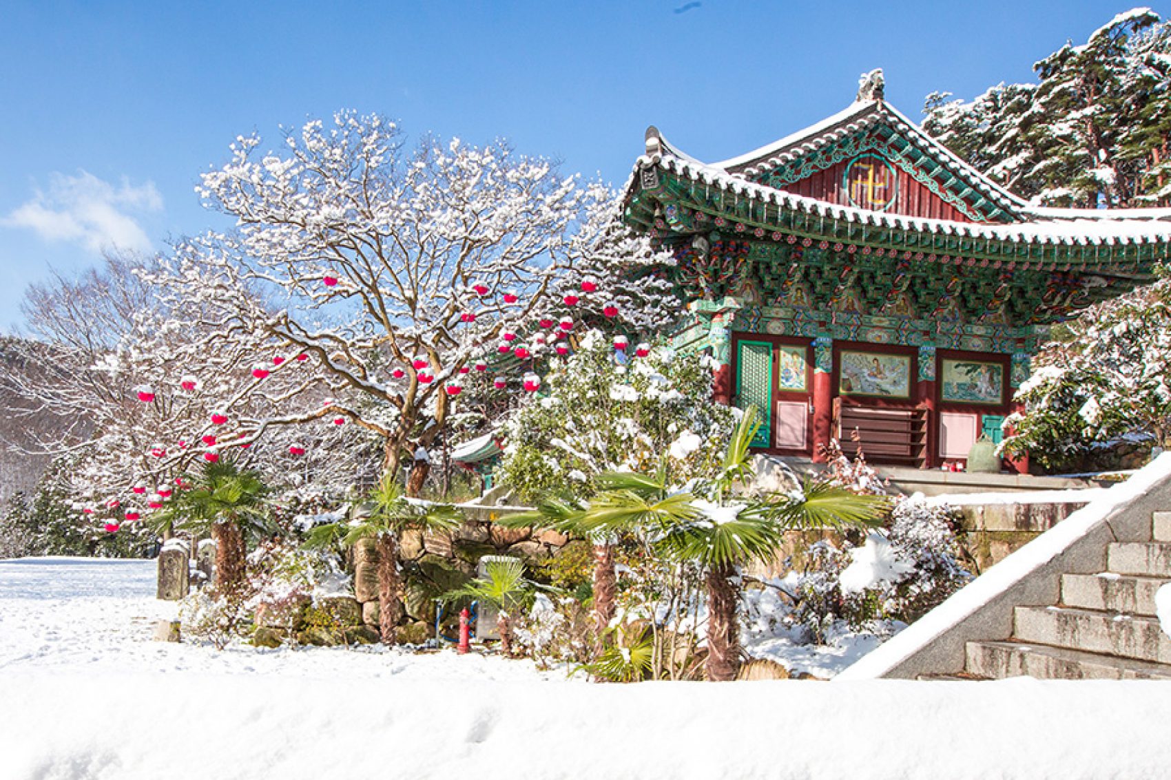 A snow-covered temple in South Korea during winter.