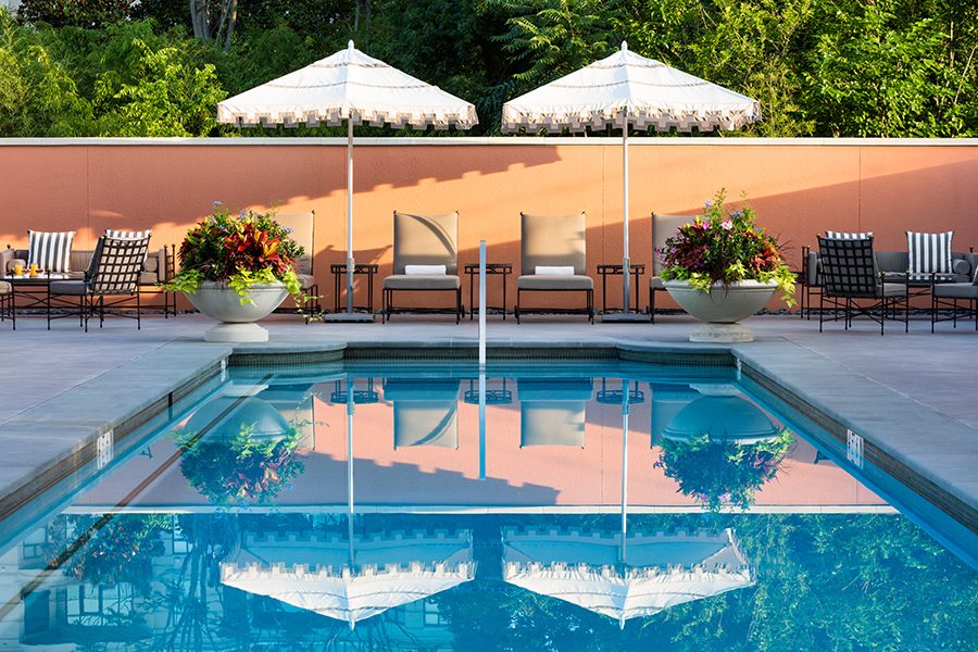 View of sunloungers facing a swimming pool at Rosewood Mansion on Turtle Creek.