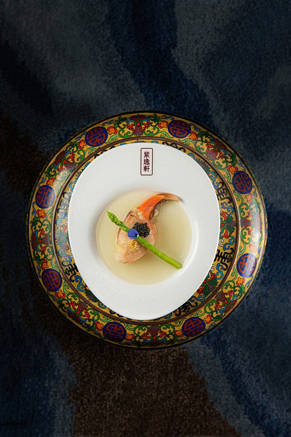 A top down shot of a crab dish with caviar, served at Zi Yat Heen at Four Seasons Macao hotel.