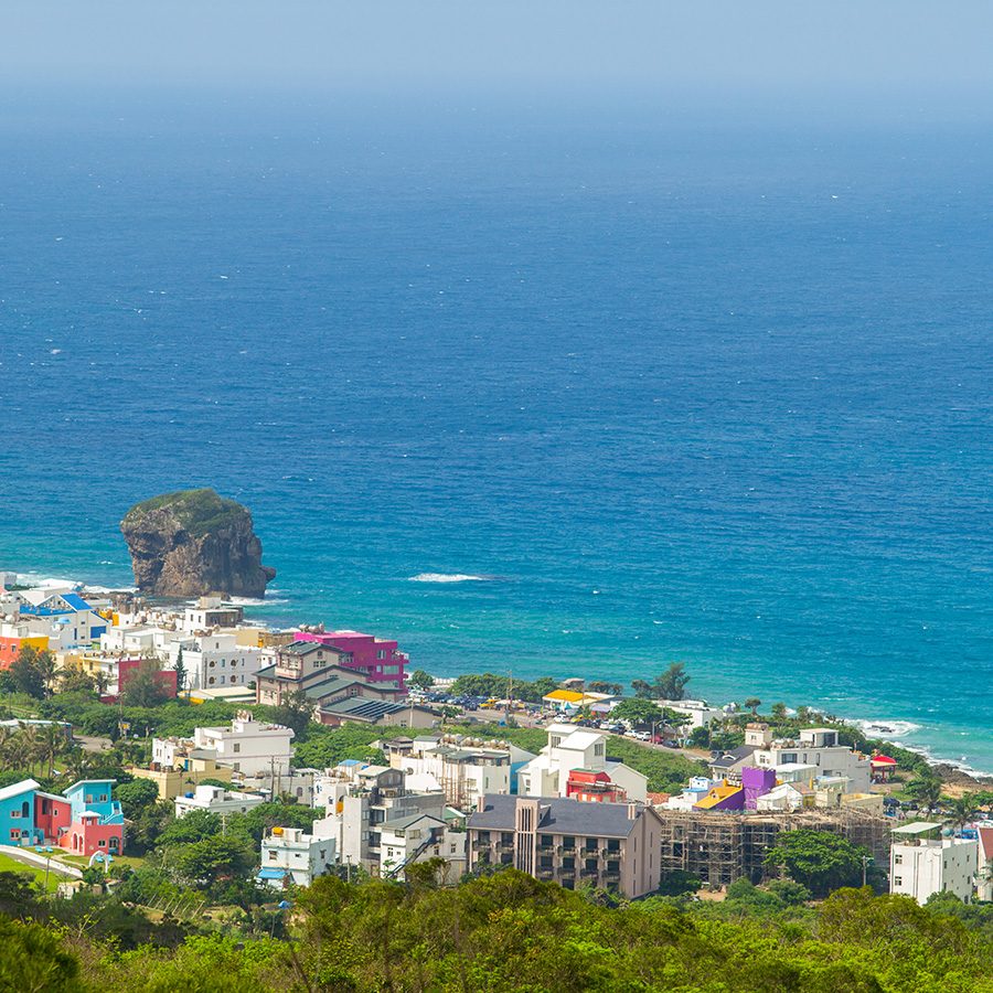 Colourful buildings by the shore of Jialeshui beach.