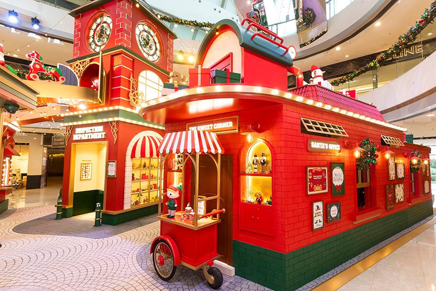 A close-up of the colourful workshop and clock tower at the Santa’s Magic Toy Factory display at IFC.