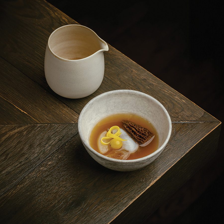 A ceramic jug and a bowl of abalone mandu at Hansik Goo, Hong Kong.